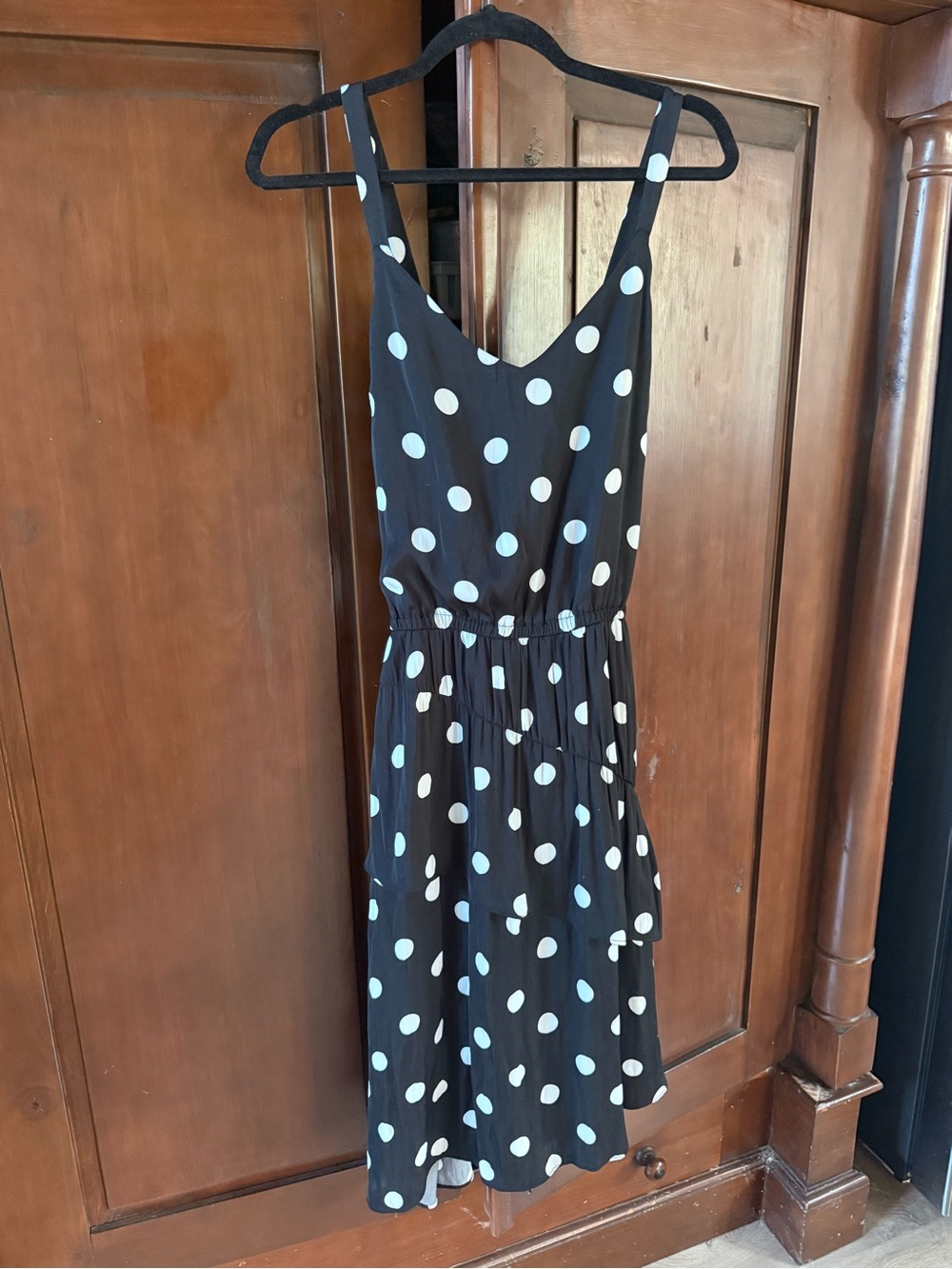 Black Polka Dot Sleeveless Dress with Asymmetrical Ruffle Hem